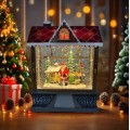 Casita iluminada navideña con Santa Claus y regalos, efecto nieve y luces LED cálidas, Por Mayoreo D-21765