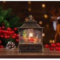 Farol navideño con luz LED cálida y efecto nieve en movimiento. Ideal para decorar sala, repisa o mesa en Navidad de diferentes diseños Por Mayoreo D-20159 