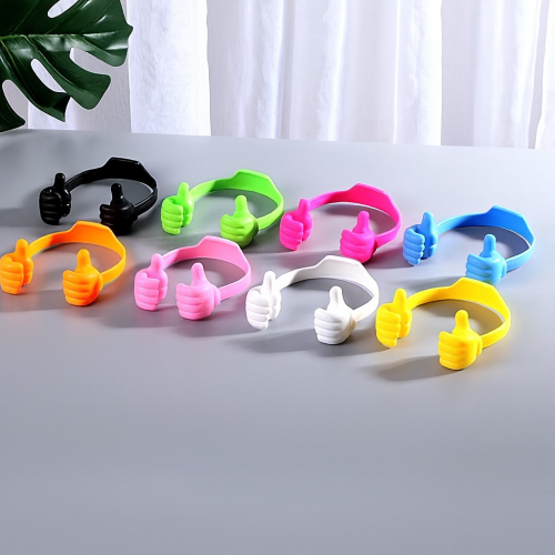 Soporte con forma de pulgares para celular y tablet, flexible, para escritorio, portátil. Colores variados. Venta por mayoreo BA-012