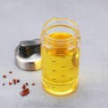 Aceitero con tapa antigoteo de vidrio y acero inoxidable. Ideal para aceite, vinagre o salsa de soya. Diseño moderno y funcional. 11491