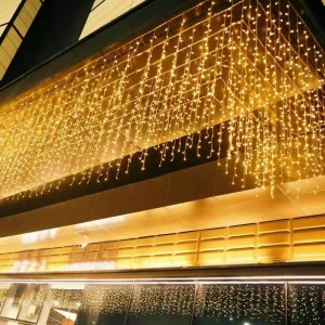 Cortina de luces LED cálidas de 3×2 m con 240 focos y conector de extensión. Ideal para decorar ventanas, fachadas o interiores con estilo navideño o festivo. Venta al por mayor