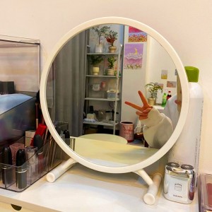 Espejo de maquillaje sin luz con diseño redondo y base estable, ideal para tocador y uso diario. Medidas 43x33 cm. Venta al por mayor. CL-LM102