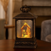 Lampara linterna decorativa navideña con nacimiento iluminado, luz led cálida y efecto copos de nieve, venta por mayoreo