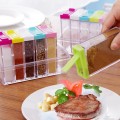 Set de especieros con 6 frascos y base. Tapas de colores surtidos. Ideal para organizar condimentos en la cocina. Venta al por mayor
