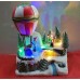 Decoración de Navidad, Papá Noel, con árbol y globo aerostático con luces LED y música 17.5x12x18.5cm USB/Pilas SDD1172