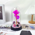 Flor decorativa para parejas con rosa artificial y luz LED en cúpula transparente con base decorativa. Ideal como regalo para San Valentin. Venta por mayoreo