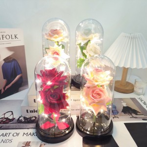 Flor artificial tipo rosa con luz LED, en cúpula transparente estilo cristal. Ideal como regalo romántico, decoración para San Valentín. Modelo XH-0501.